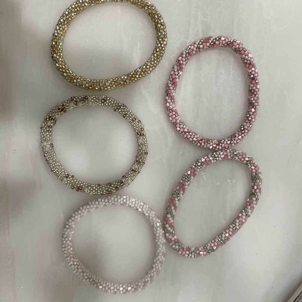 Pink and gold bracelets